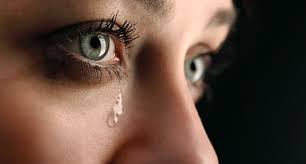 image of tears coming from a woman's eyes